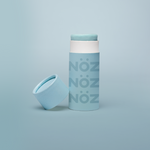 Load image into Gallery viewer, Blue Nöz Sunscreen bottle is standing, the cap is off and it is placed near the bottle.
