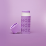 Load image into Gallery viewer, Purple Nöz Sunscreen bottle is standing, the cap is off and it is placed near the bottle.
